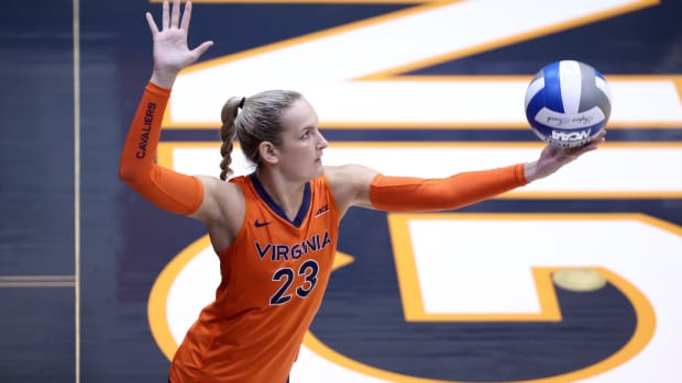 Regan Trueblood serves the ball during the Virginia volleyball match against Rider at Memorial Gymnasium.